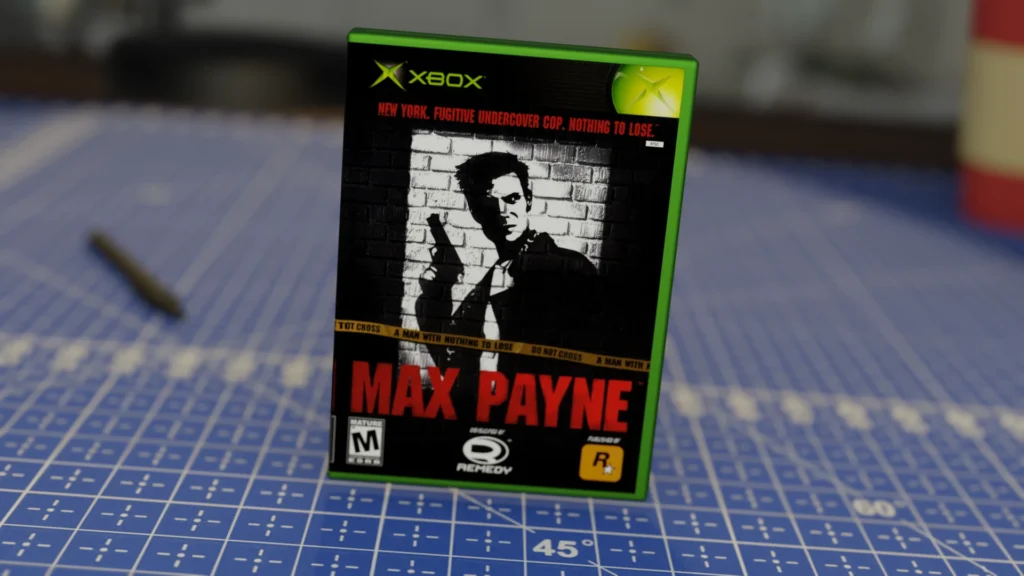 Carátula del videojuego Max Payne para Xbox, con un diseño en blanco y negro de un hombre armado de espaldas a una pared de ladrillos, con su nombre en rojo y una cinta de precaución cruzando la portada.
